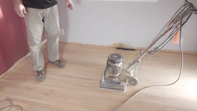 Can you walk on hardwood floors after sanding