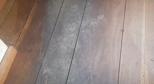 Is it necessary to remove furniture before cleaning the hardwood floor grooves